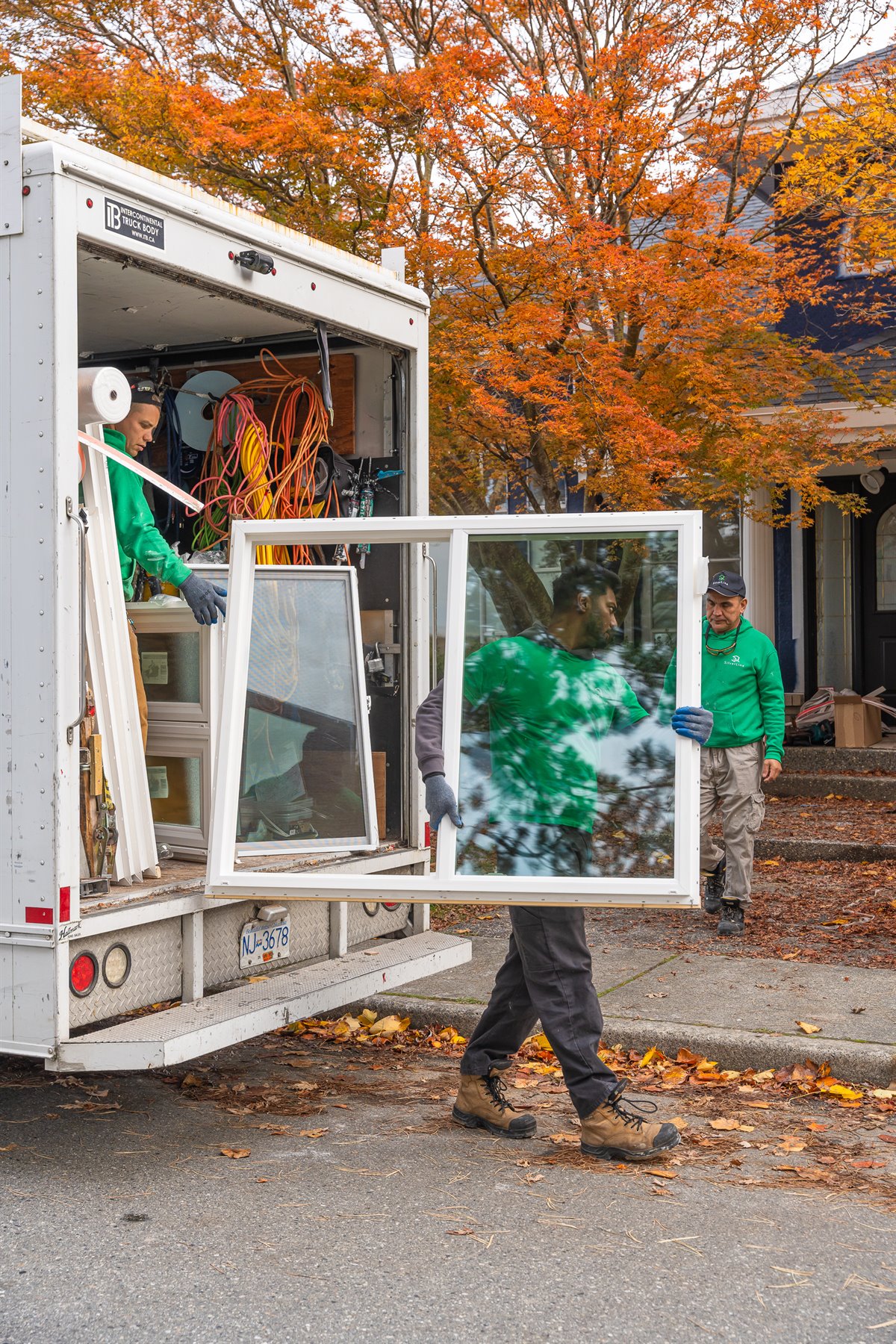 Silverline installation team unloading locally made replacement windows at a Vancouver home