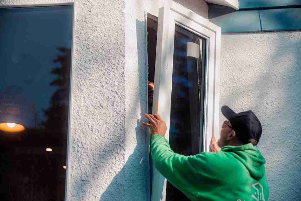 Silverline installer fitting a replacement window on a Lower Mainland home
